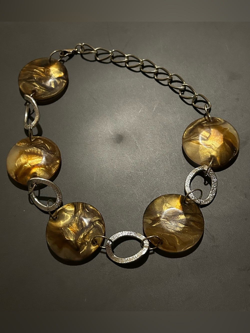 brown and silver swirl statement necklace